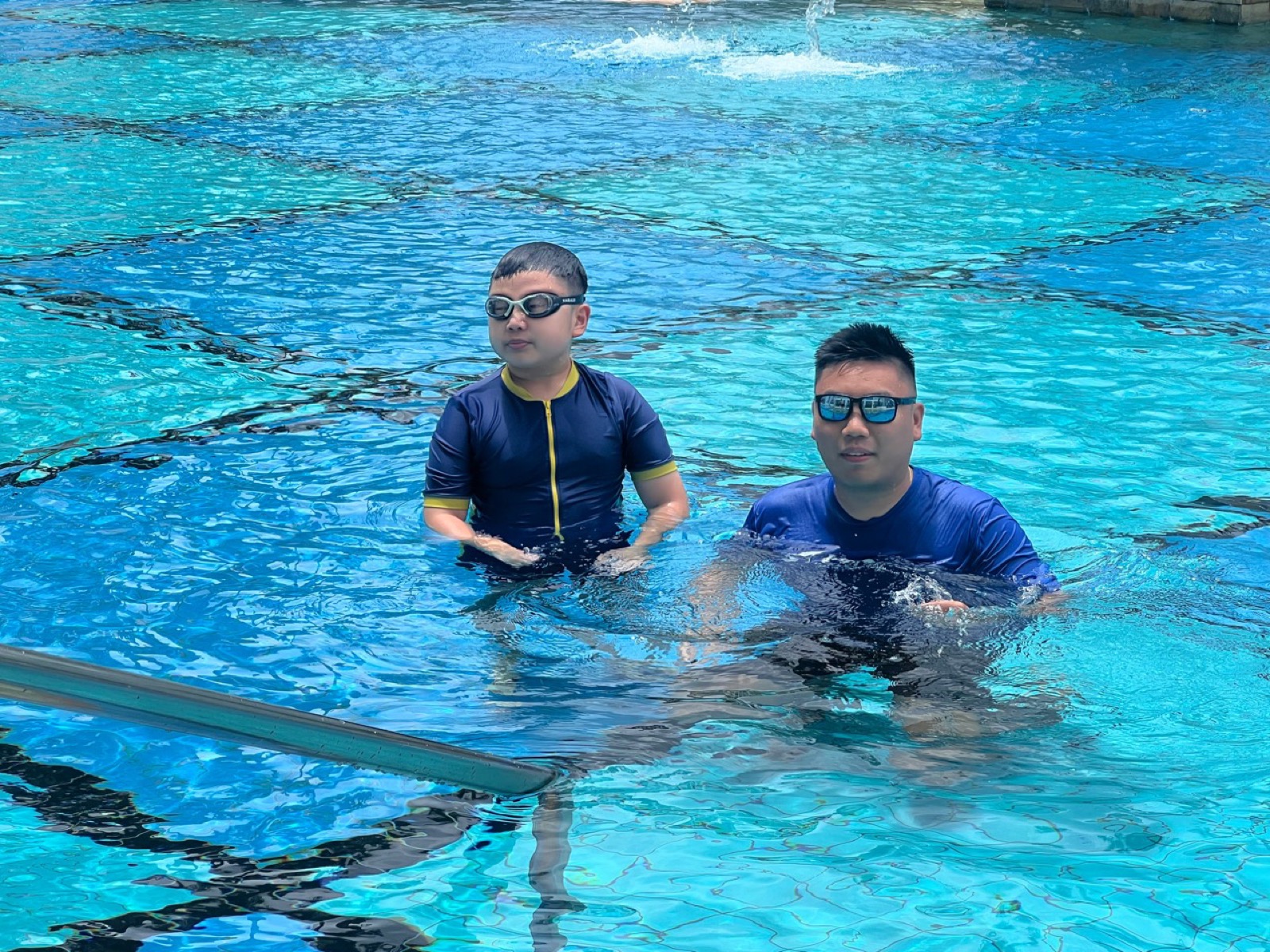 Penguin Swim School coach and learner preparing swimming skills relevant to SwimSafer progression